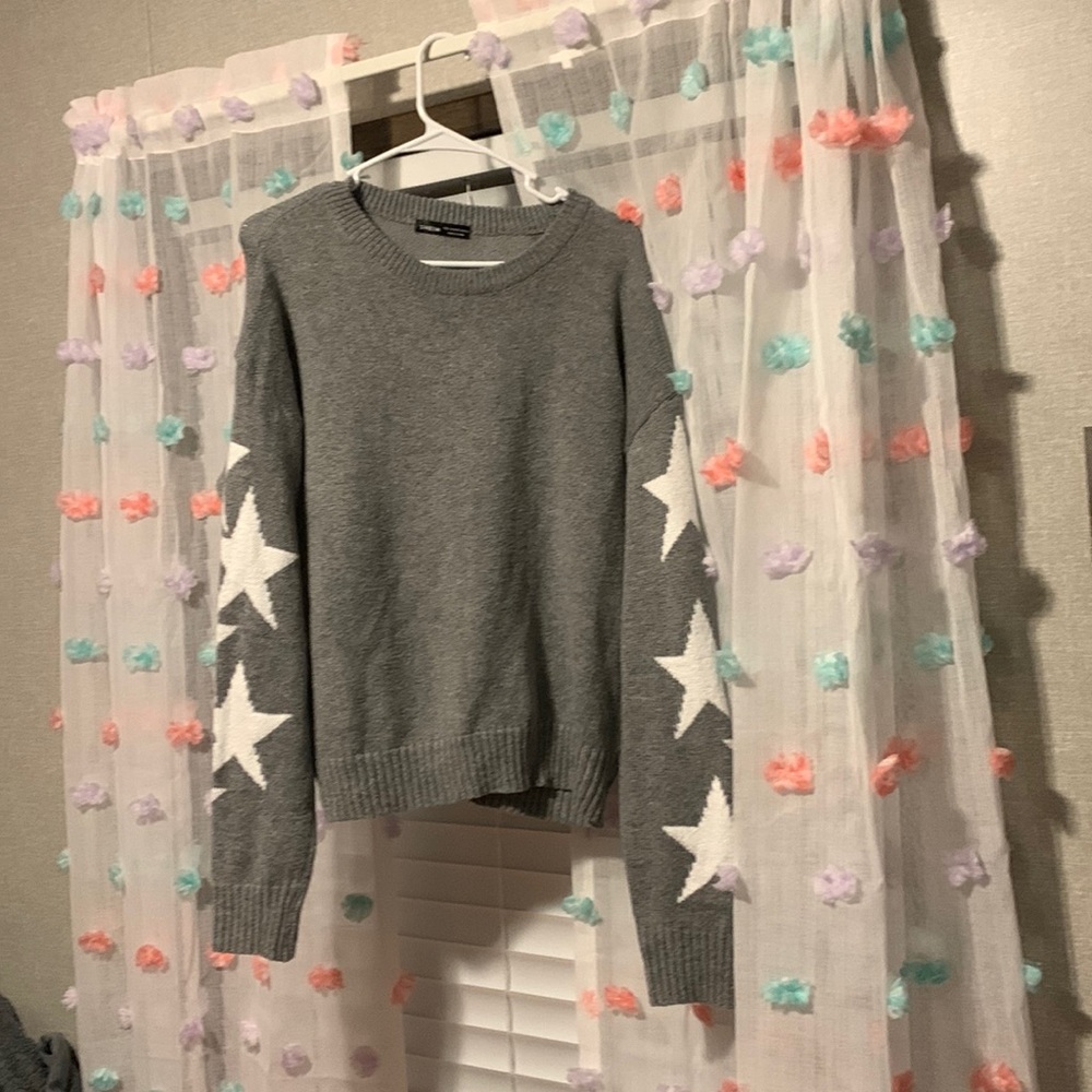 Grey sweater with white stars. Size large.